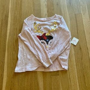 Pink sweater with penguin and antlers decal